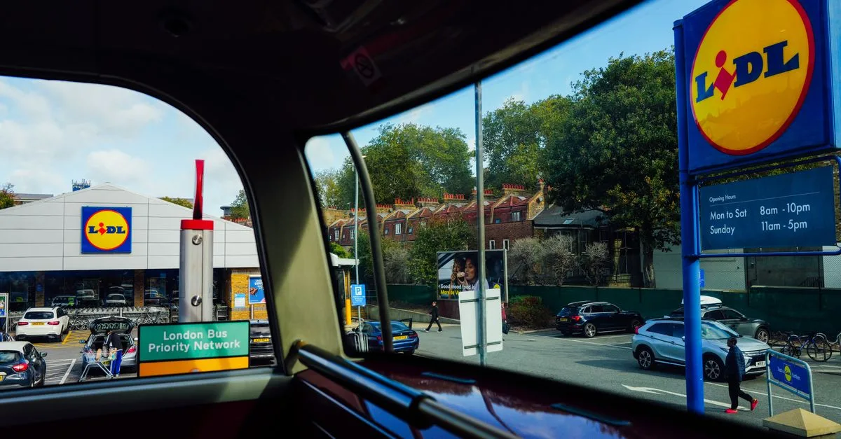 Outside view of a Lidl store from inside a London bus with clear signage.