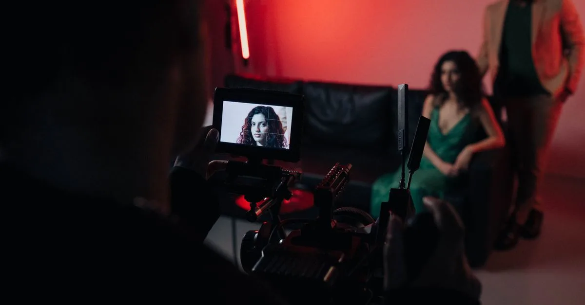 Behind the scenes of a studio filming session focused on actors within a creative setup.