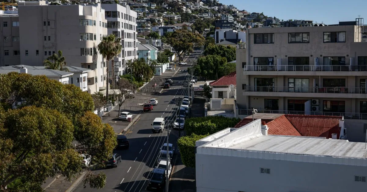 Aerial view of Cape Town's residential streets with modern architecture during daytime.