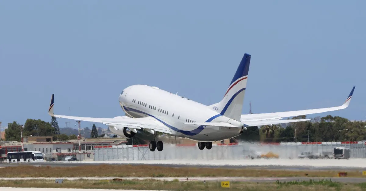 A commercial airplane takes off from a runway on a clear day, showcasing aviation and travel concepts.