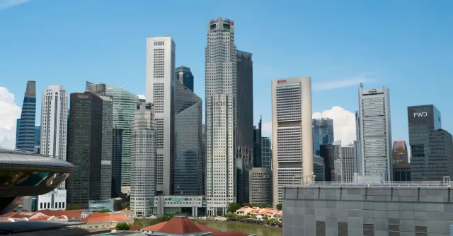 View of Singapore skyline showcasing modern skyscrapers on a clear day.