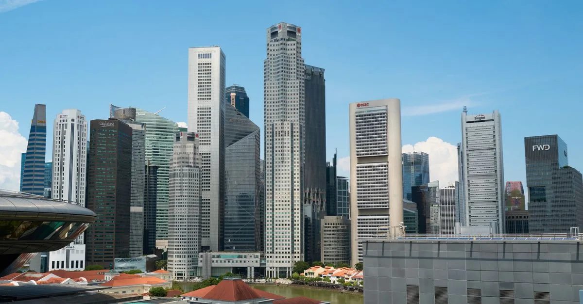 View of Singapore skyline showcasing modern skyscrapers on a clear day.