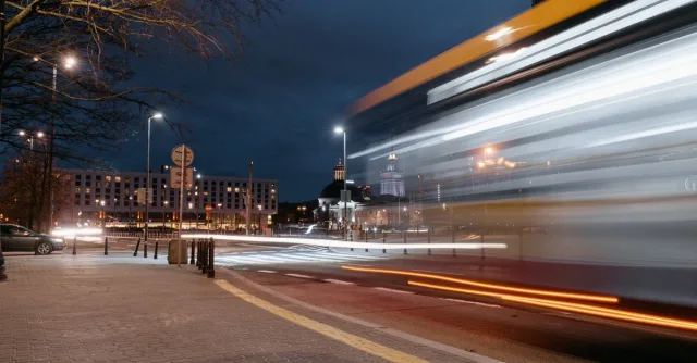 Nighttime city scene with blurred lights from traffic, capturing urban energy.
