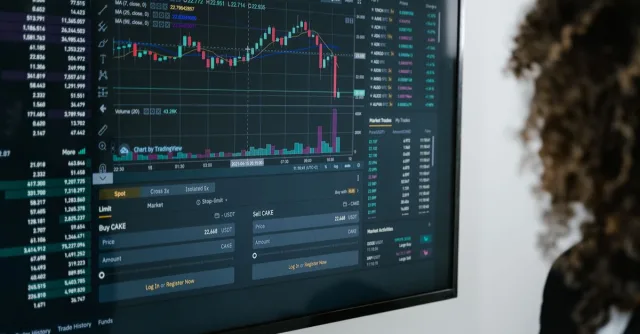 Detailed view of a financial analysis chart on a monitor with cryptocurrency trading data.