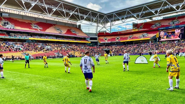 A wide shot of a professional football stadium during a match.