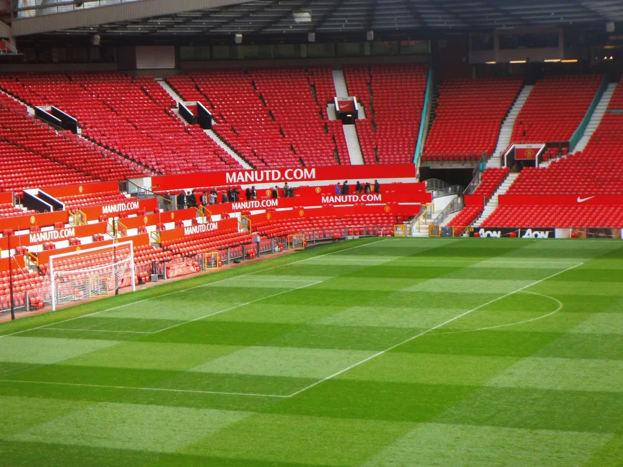 A professional football stadium pitch prepared for a match.