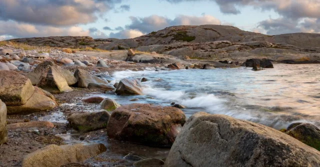 Gorgeous rocky seaside landscape with waves in Gullbringa, Sweden.