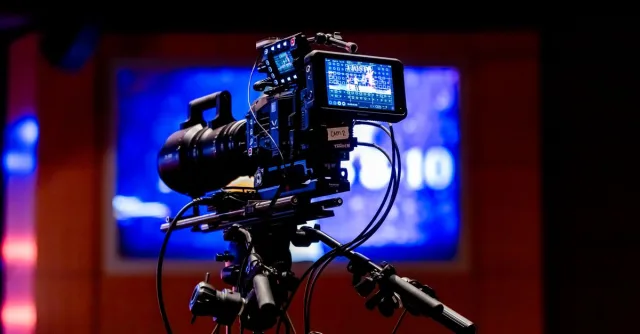 High-tech video camera setup in modern studio environment, showcasing professional equipment for filming.