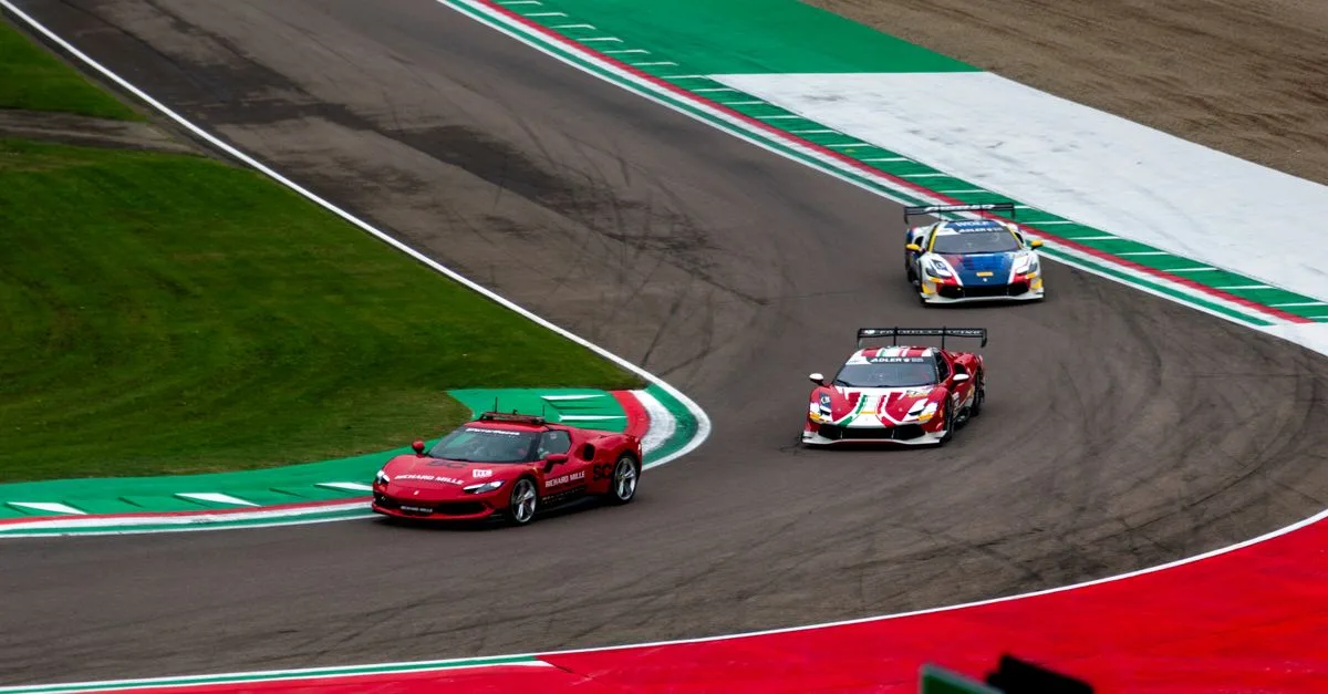 Exciting view of high-speed race cars navigating a professional racing track curve.