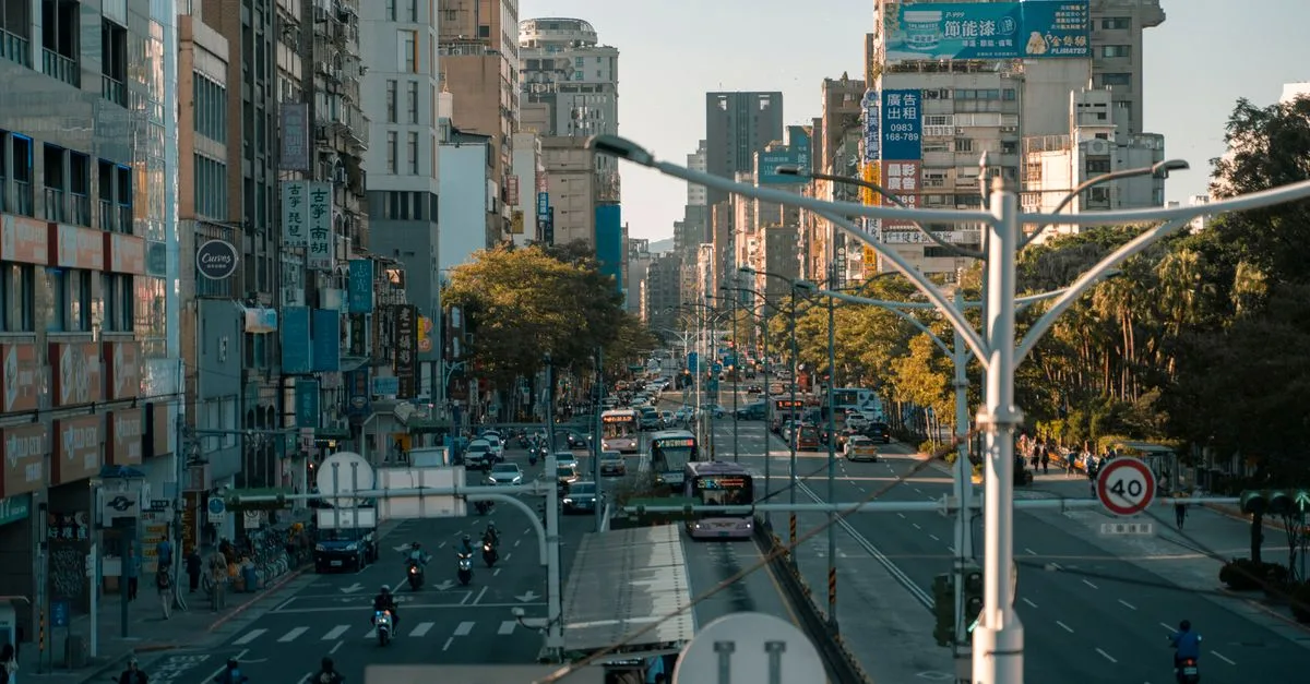 A busy street scene showcasing the vibrant urban life in a modern cityscape.
