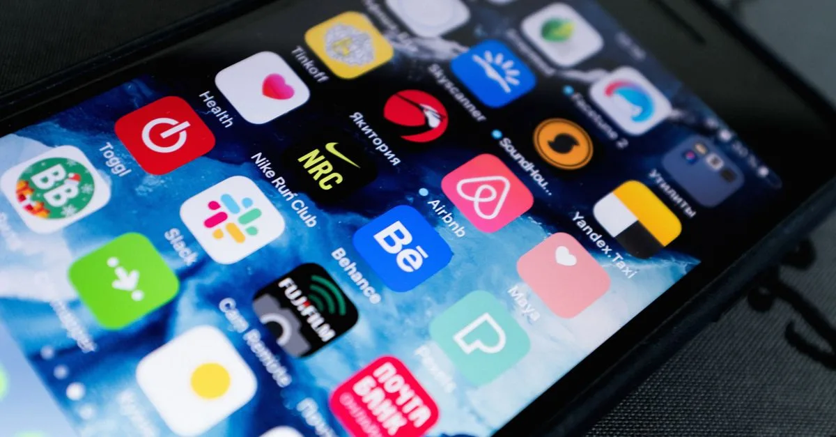 Detailed view of smartphone displaying multiple app icons on screen, highlighting technology use.