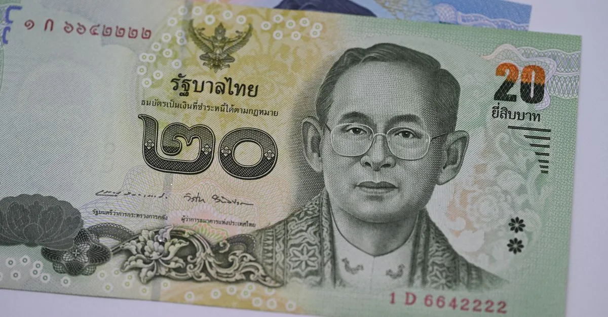 Detailed image of a 20 Thai Baht banknote highlighting traditional Thai design and currency features.