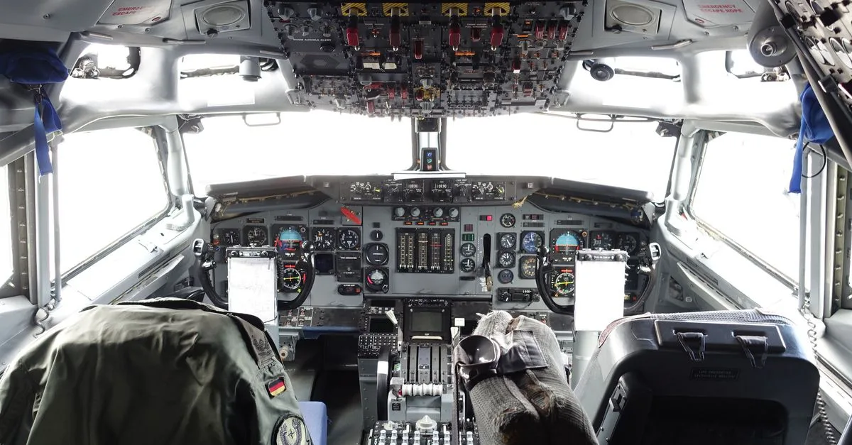 Explore the intricate aircraft cockpit, showcasing aviation controls and design.