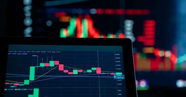 Close-up view of digital trading chart screen with vibrant graphs and data analysis.