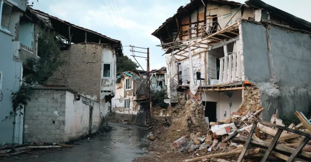 Destroyed buildings in an urban area after an earthquake.