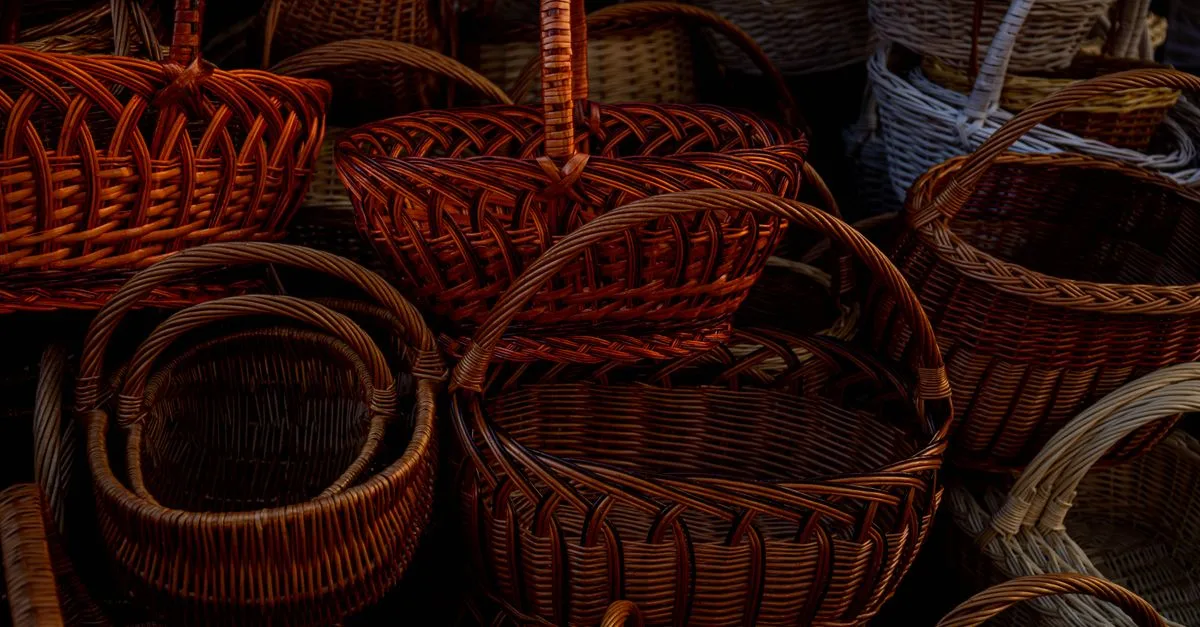 Close-up of various handcrafted wicker baskets, showcasing intricate woven designs.