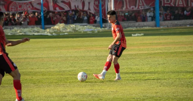 Exciting soccer match captured in Mendoza, highlighting a player's intense focus.